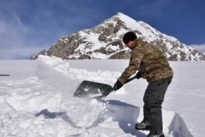 Shoveling snow with backpacking shovel