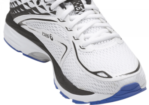 Close-up of a white and black running shoe with blue accents, featuring a mesh upper and a cushioned sole, suitable for hiking.