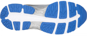 Bottom view of a sneaker sole featuring a blue and gray tread pattern with distinctively shaped lugs for enhanced grip, suitable for hiking in running shoes.