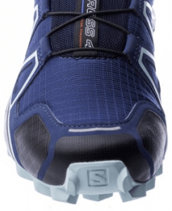 Trail running shoe with tight mesh design