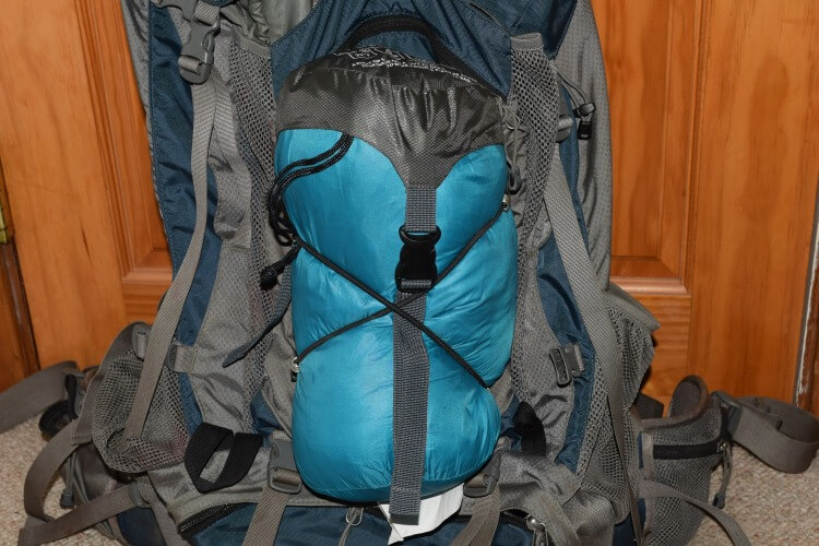 Using two 10-inch bungee cords as lashings on backpack