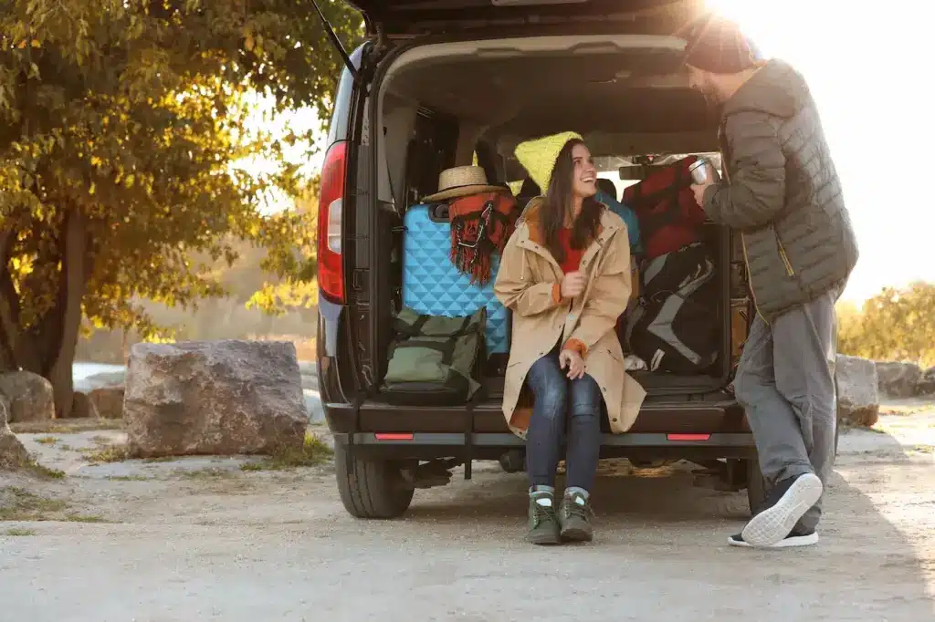 Couple Camping Out Of A Van