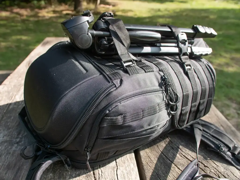 Camera Bag with Tripod on a Picnic Table