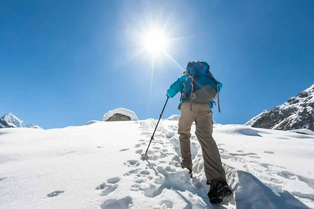 Man Hiking In The Snow